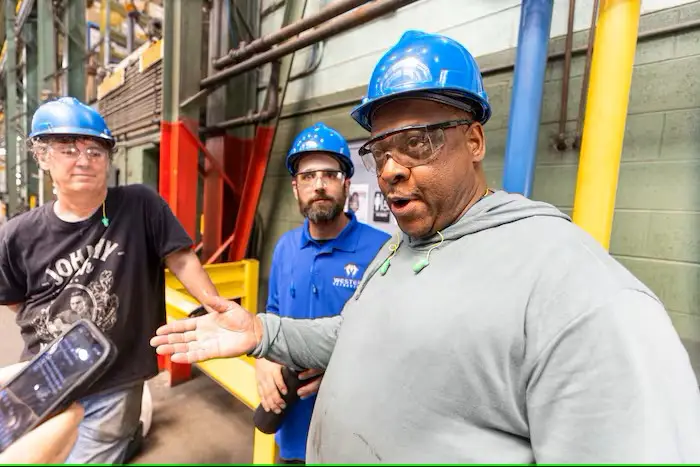 Ron Oxendine, Marlton, N.J., Press Operator, foreground, and colleagues at Western Extrusions in Pennsauken.